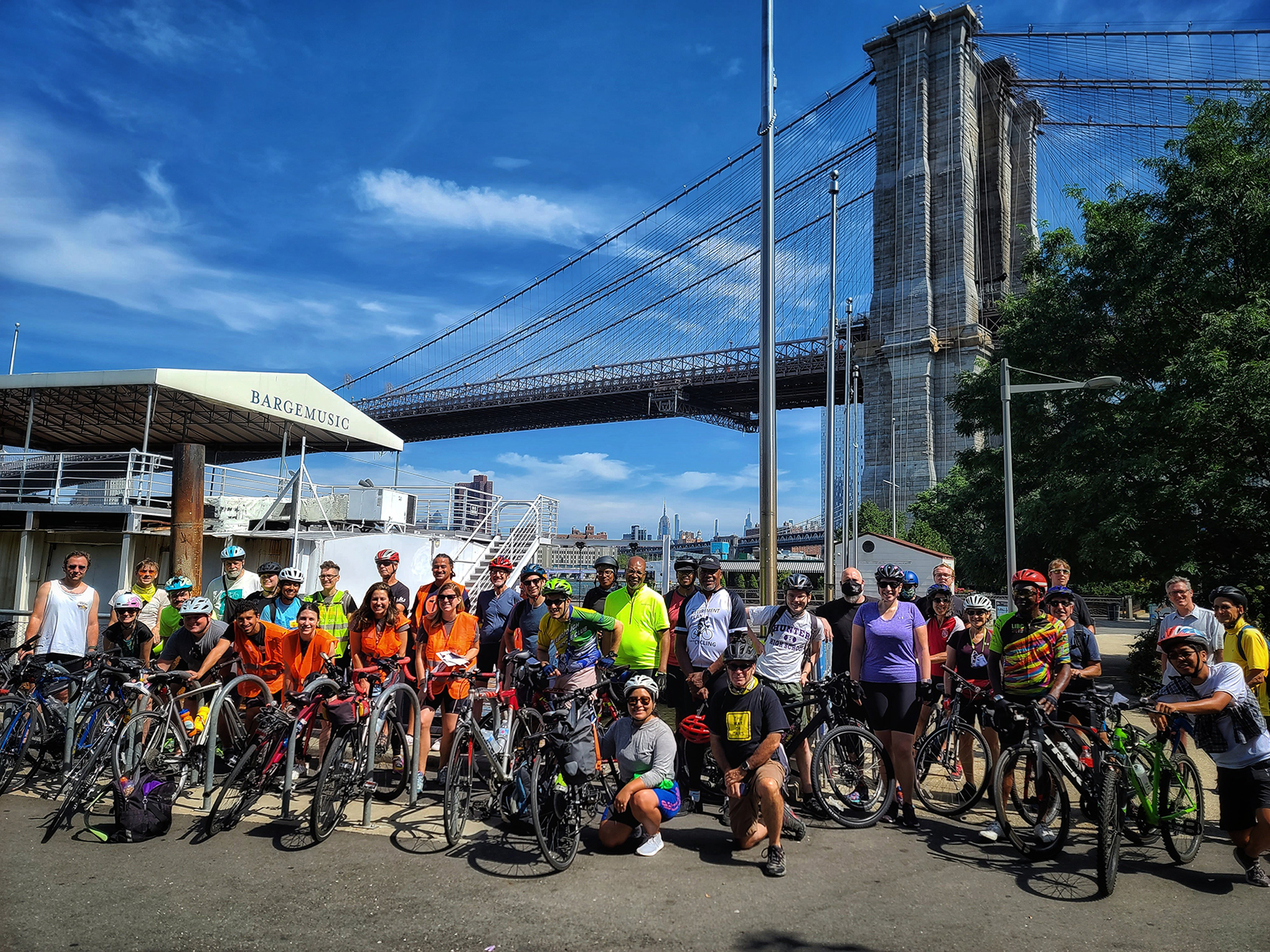 Activists posed for a photo in front of the Brooklyn Bridge