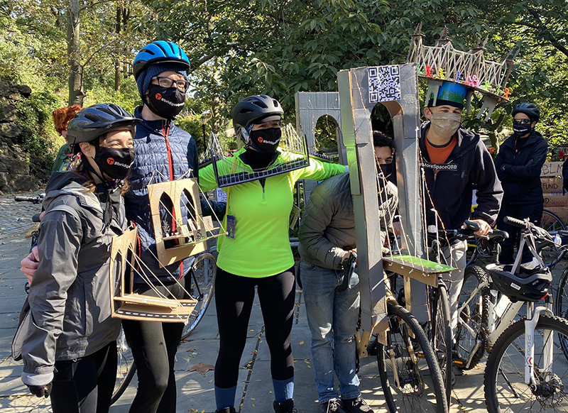 Photo of activists in costumes inspired by NYC bridges