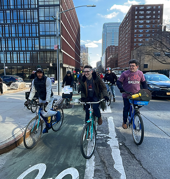 CM Restler, Brooklyn BP Antonio Reynoso, and Bridges 4 People supporters biking down Jay Street